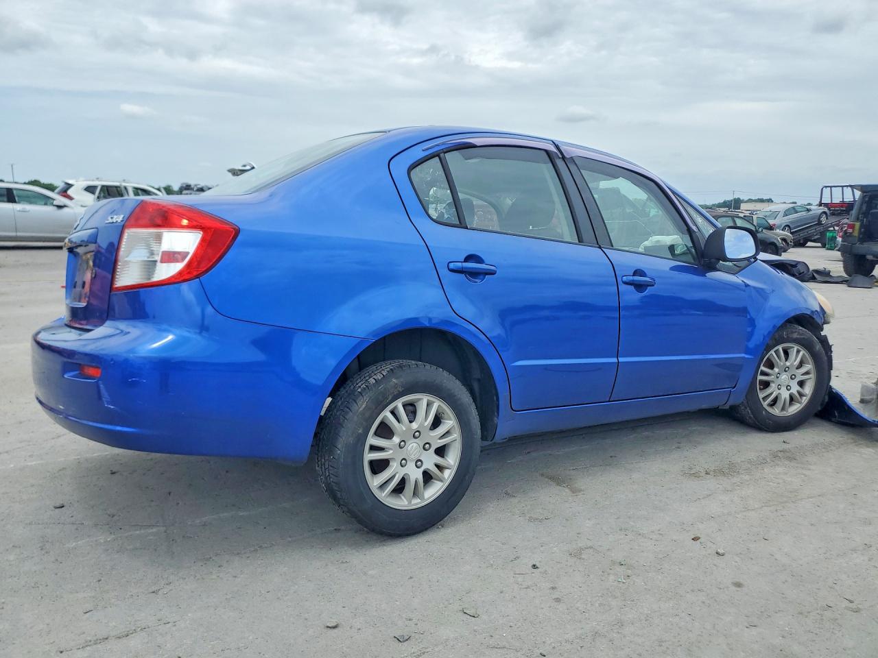2012 Suzuki Sx4 Le Blue vin: JS2YC5A38C6300179