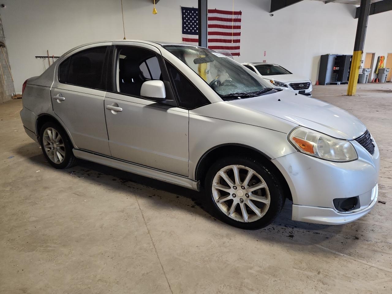 2011 Suzuki Sx4 Sport Silver vin: JS2YC5A42B6300458 Damage: Right Rocker Panel Molding, Heavy Scratch, 1 To 2 Inches