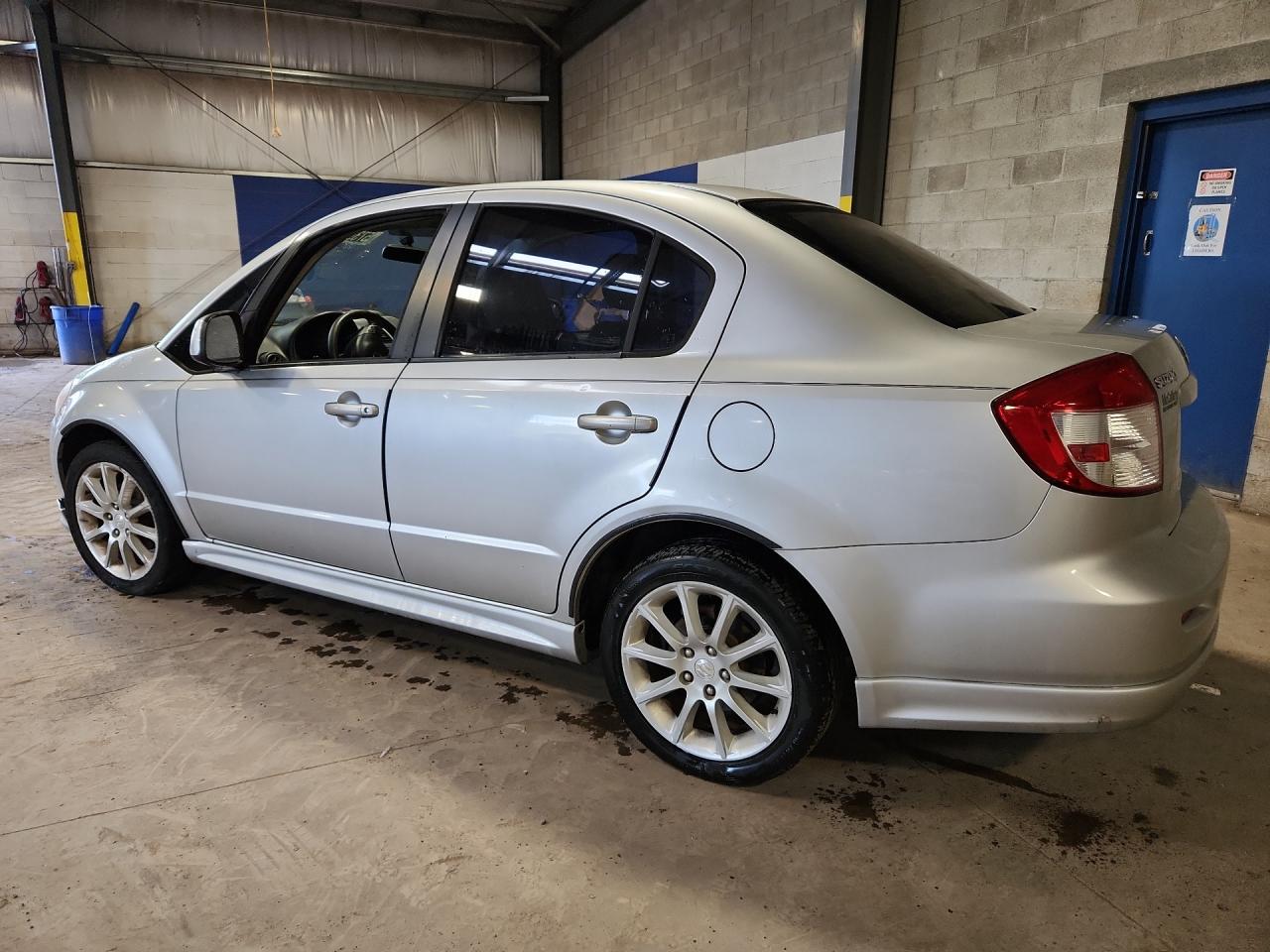 2011 Suzuki Sx4 Sport Silver vin: JS2YC5A42B6300458 Damage: Left Rear Door, Dent(S) W/ Paint Dmg, 1/2 To 1 Inch