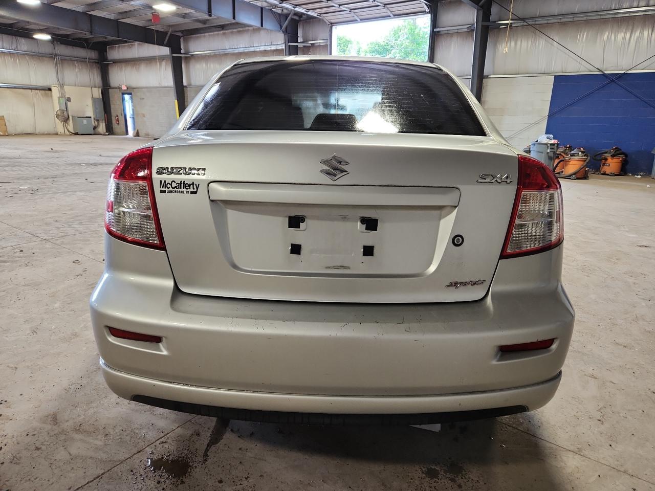 2011 Suzuki Sx4 Sport Silver vin: JS2YC5A42B6300458 Damage: Rear Bumper/Cover, Scraped, 9 To 10 Inches