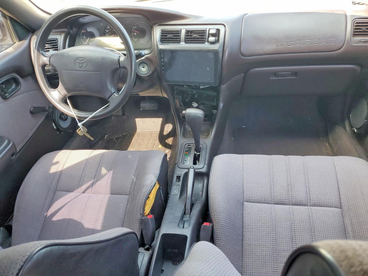 1994 Toyota Corolla Base Tan vin: JT2AE04B9R0086836