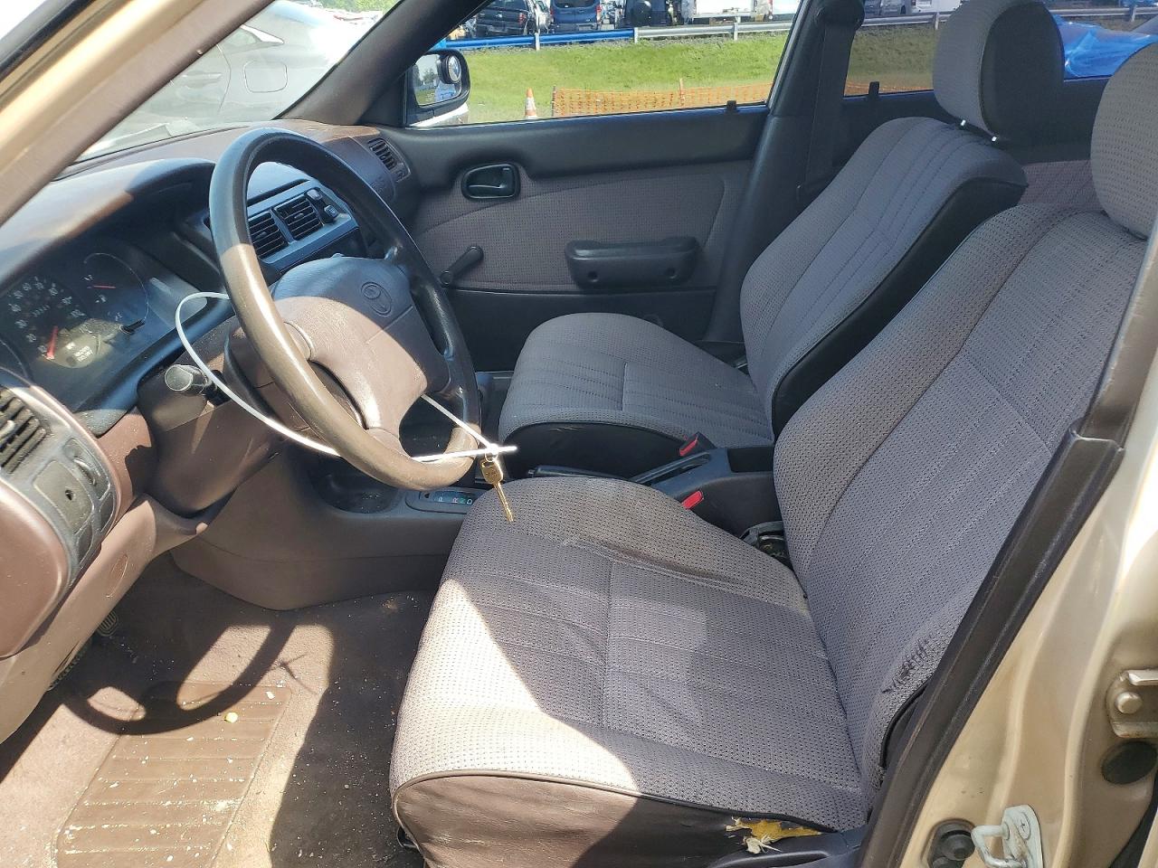 1994 Toyota Corolla Base Tan vin: JT2AE04B9R0086836