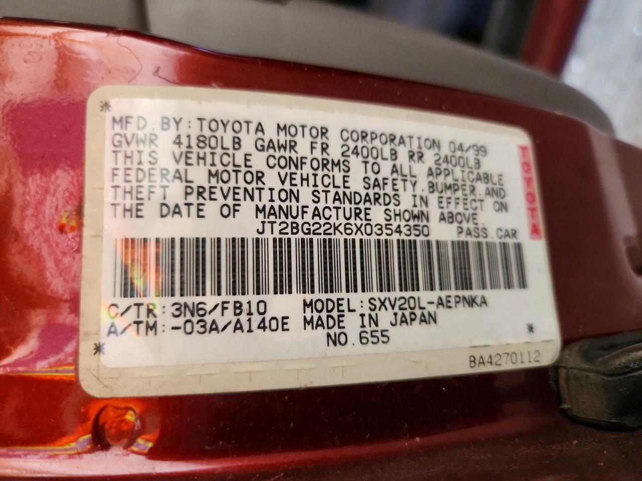 1999 Toyota Camry Le Red vin: JT2BG22K6X0354350