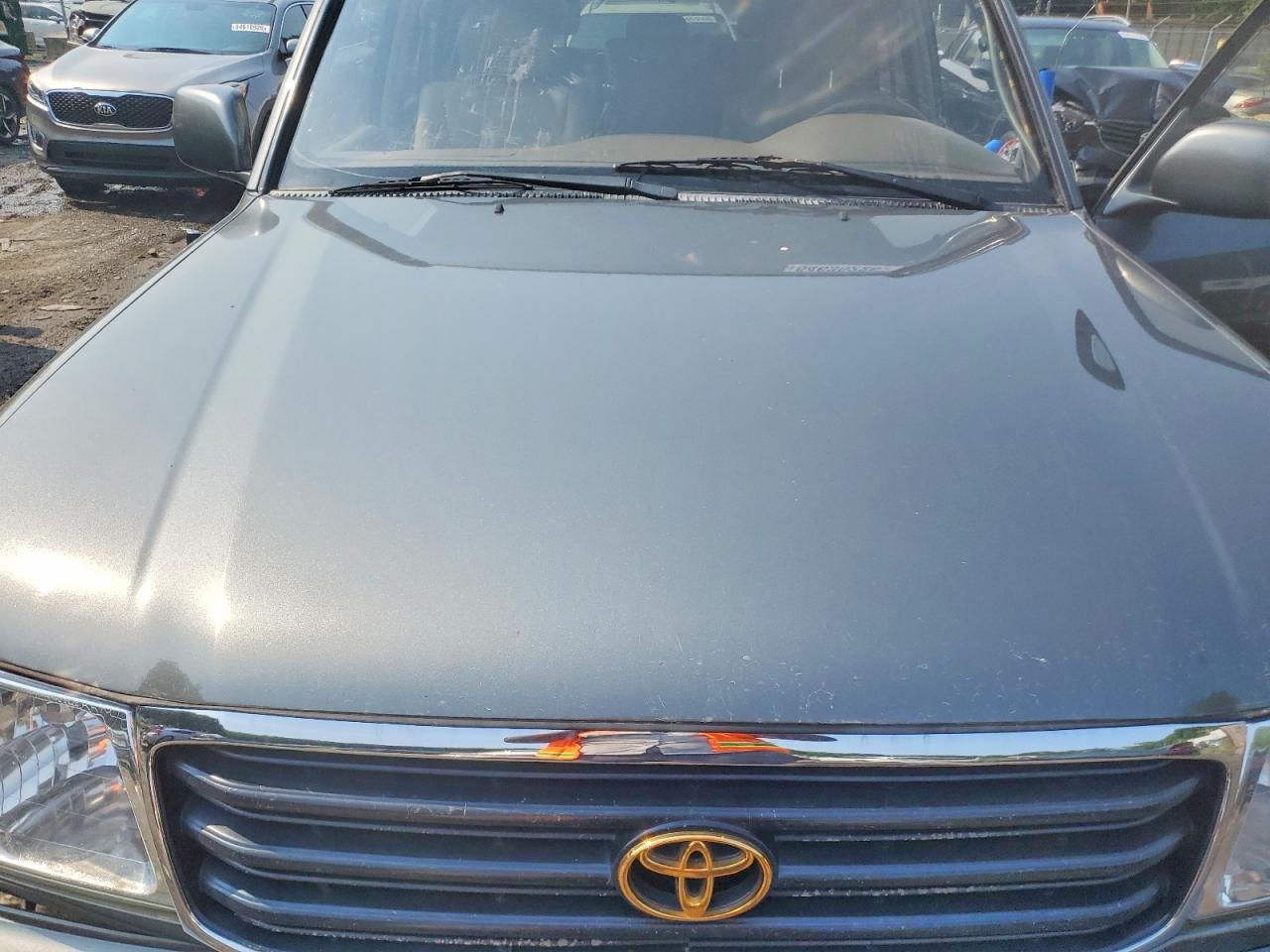 2000 Toyota Land Cruiser Base Brown vin: JT3HT05J0Y0095087