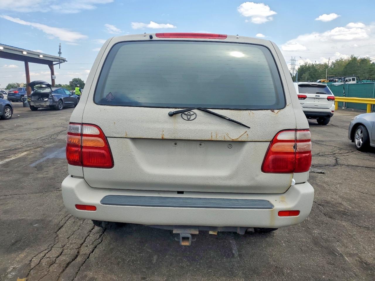 2000 Toyota Land Cruiser Base Beige vin: JT3HT05J2Y0096774