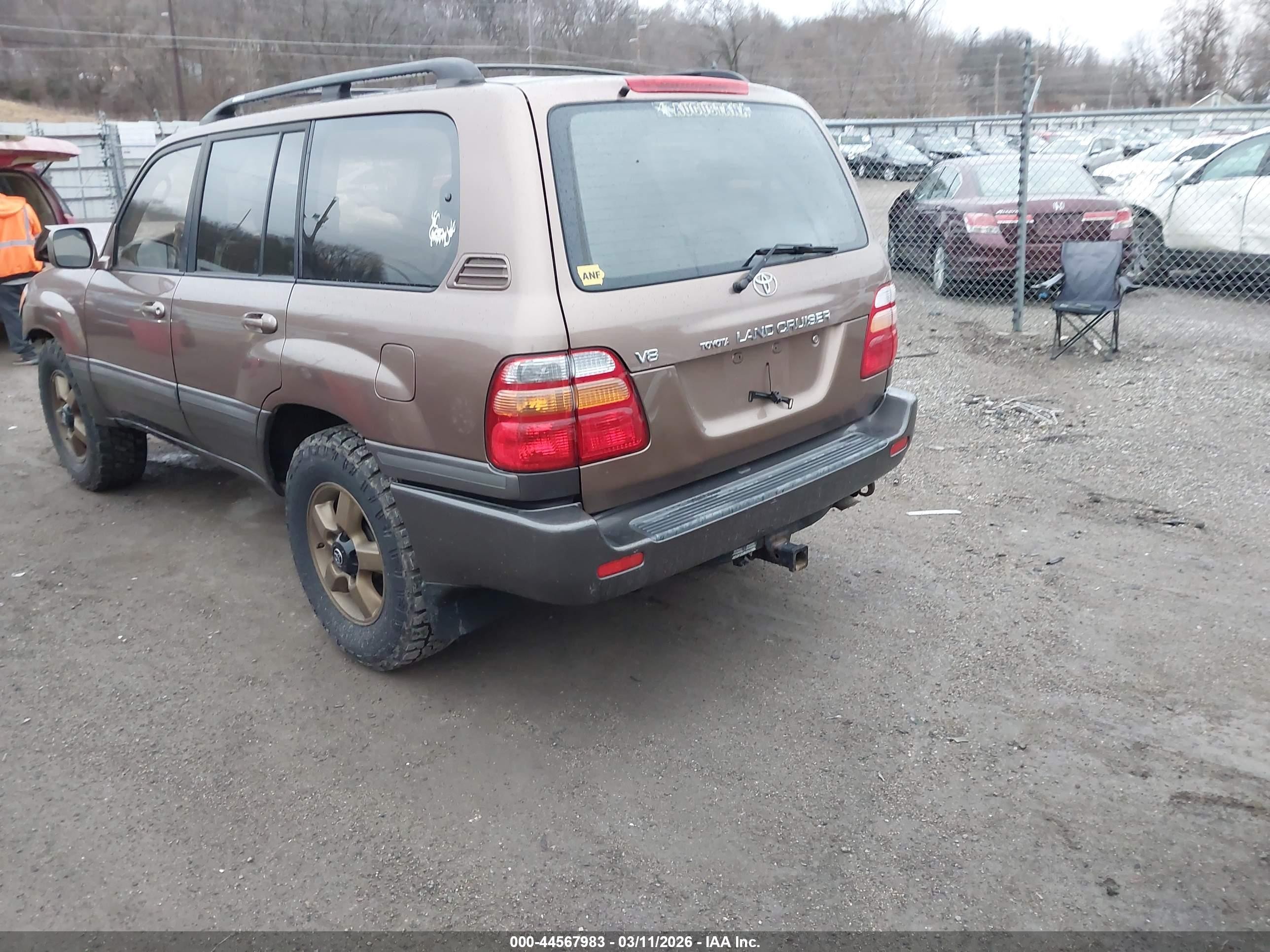2000 Toyota Land Cruiser   Tan vin: JT3HT05J3Y0102811