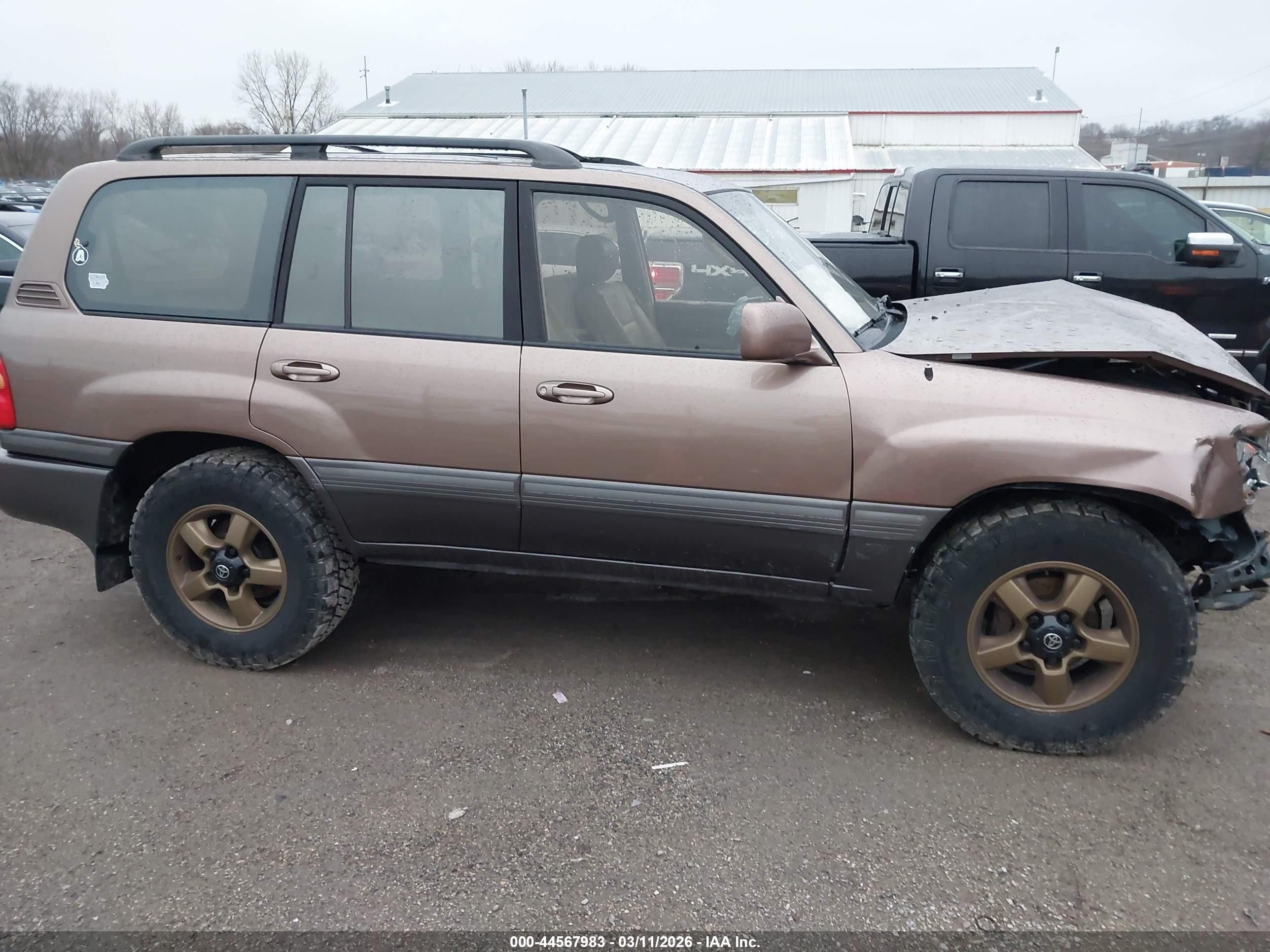 2000 Toyota Land Cruiser   Tan vin: JT3HT05J3Y0102811