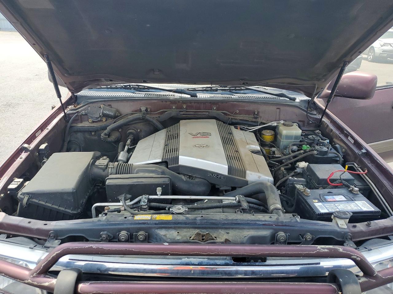 2000 Toyota Land Cruiser Base Burgundy vin: JT3HT05JXY0092567