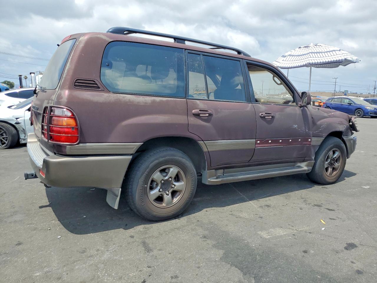 2000 Toyota Land Cruiser Base Burgundy vin: JT3HT05JXY0092567