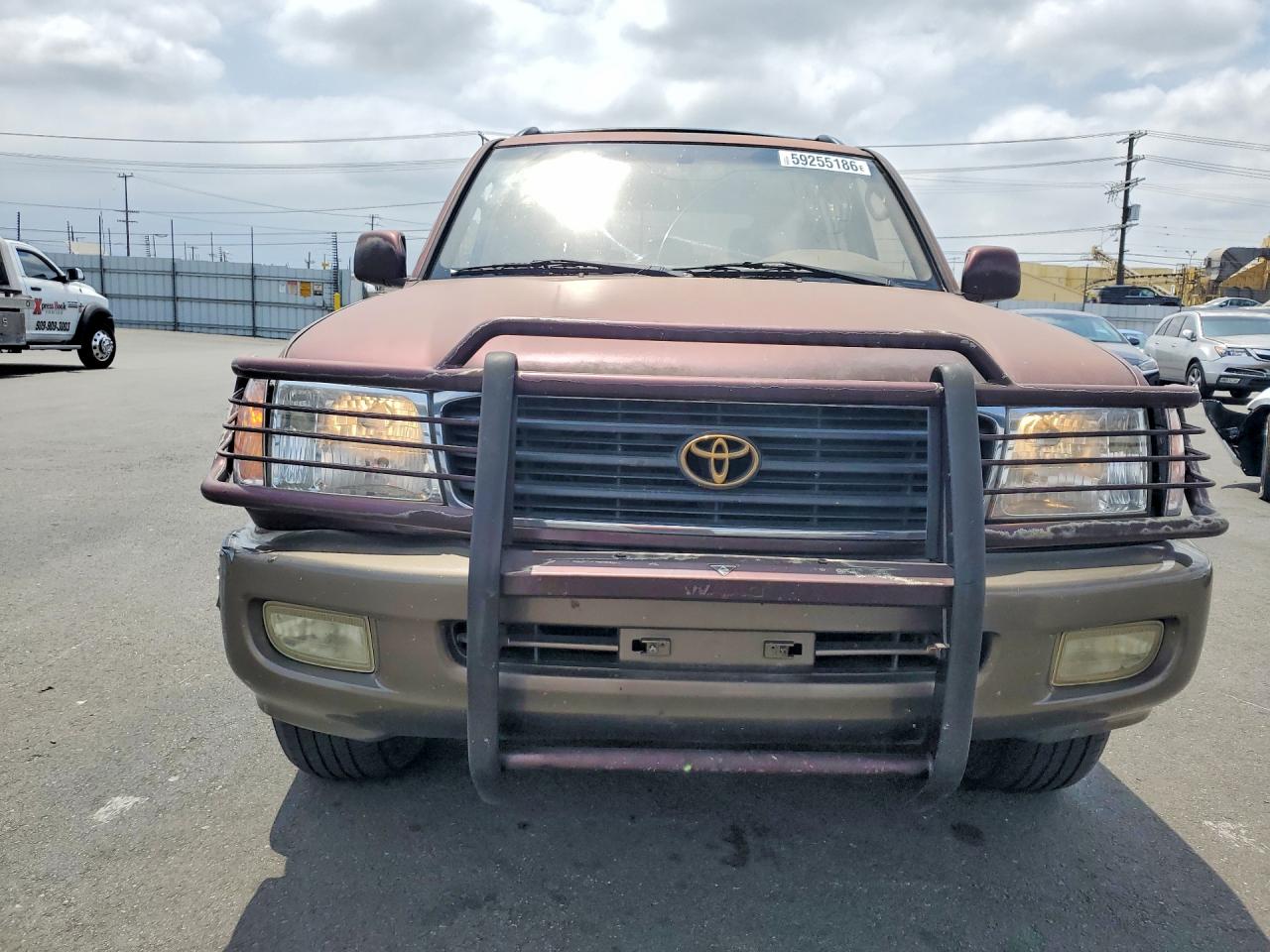 2000 Toyota Land Cruiser Base Burgundy vin: JT3HT05JXY0092567