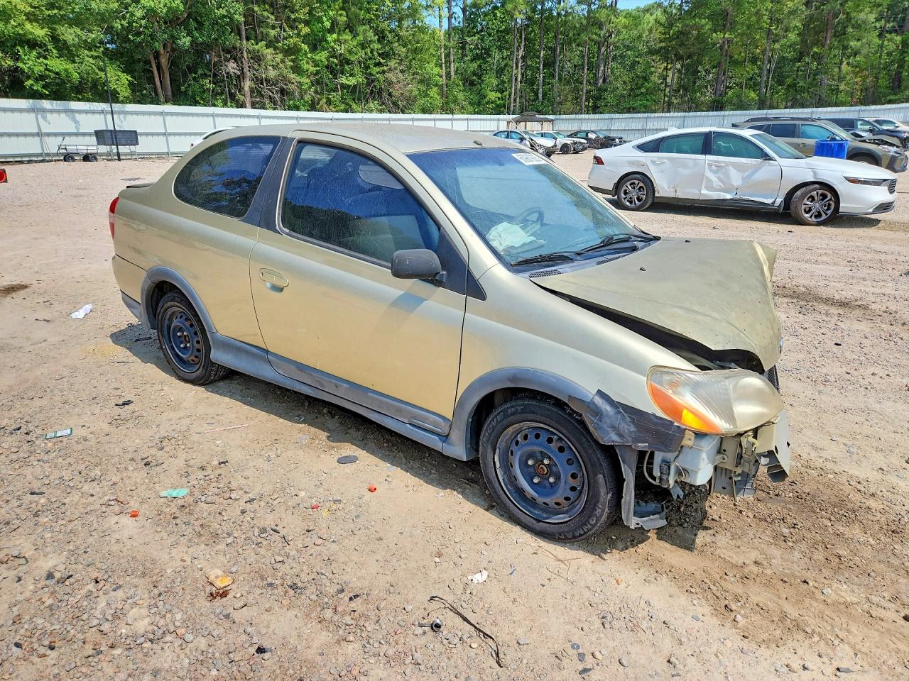 2001 Toyota Echo Base Золотой vin: JTDAT123510158182