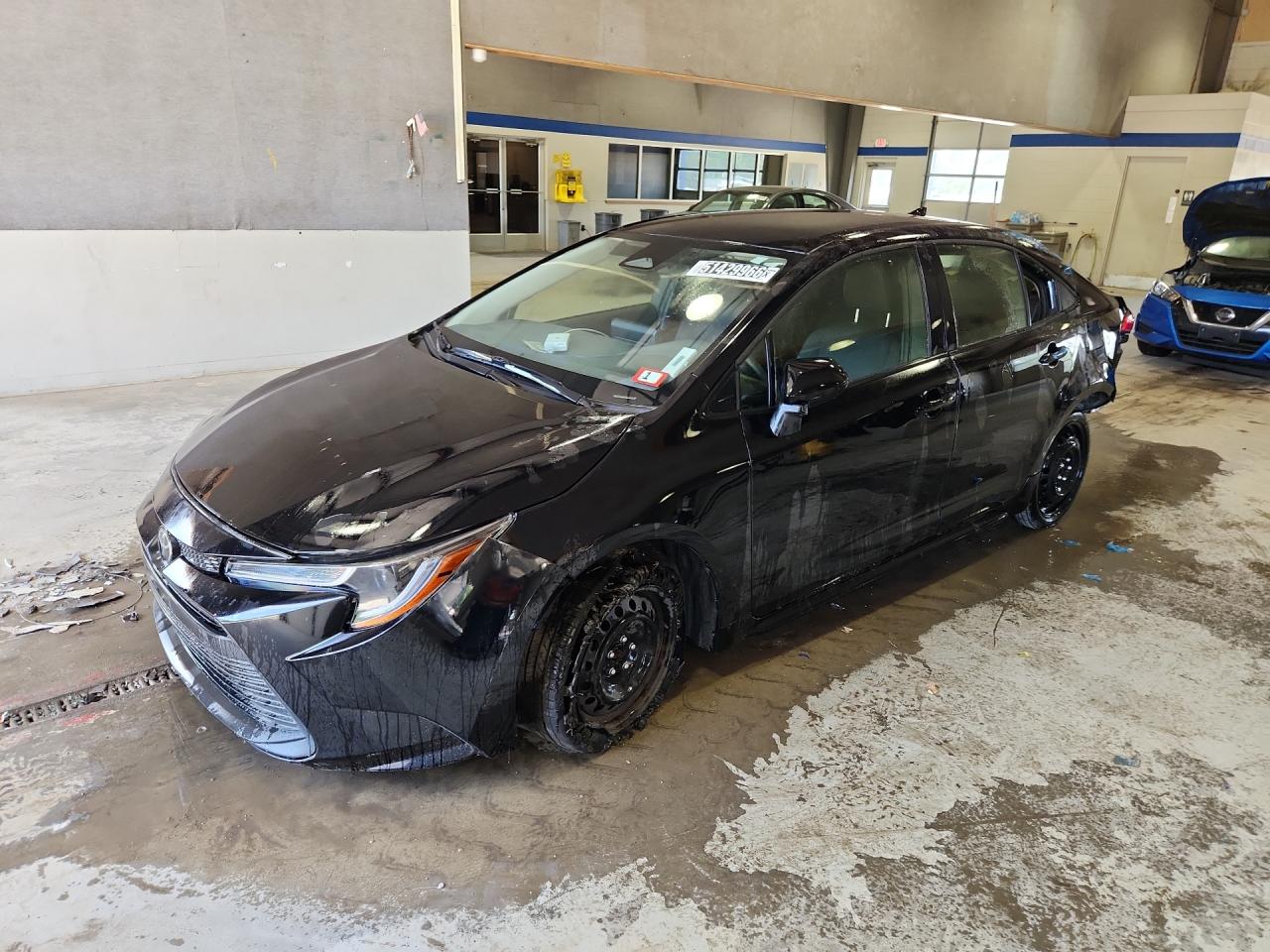 2024 Toyota Corolla Le Black vin: JTDB4MEE4R3016643 Damage: Left Front Wheel Cover, Broken, Replacement Required