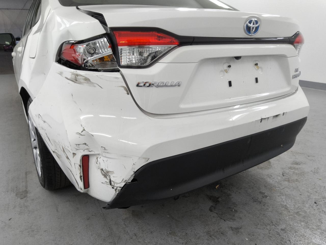 2023 Toyota Corolla Hybrid Le White vin: JTDBCMFE2P3002352 Damage: Rear Bumper, Broken, Replacement Required