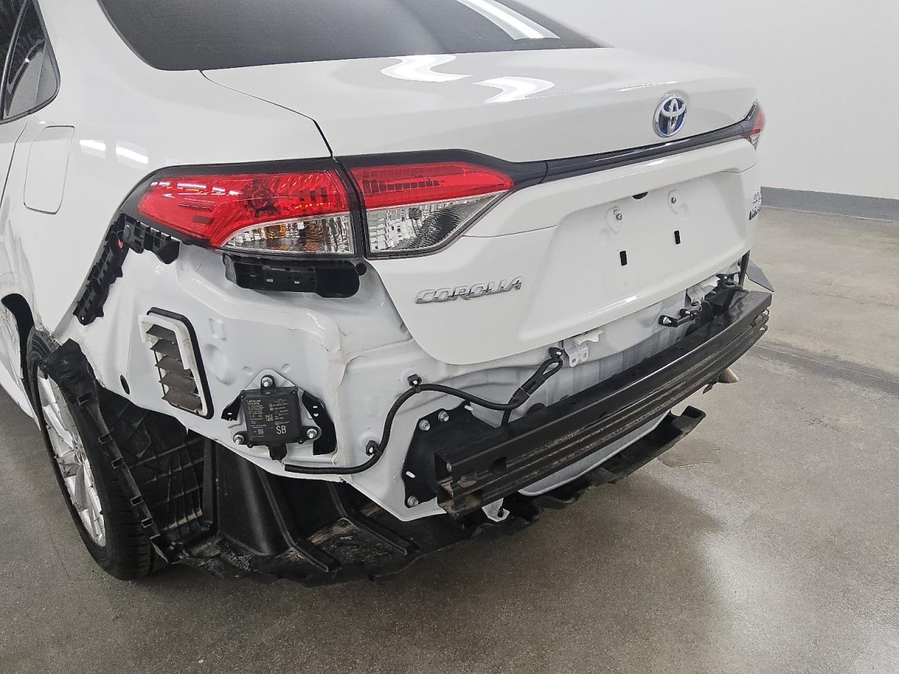 2024 Toyota Corolla Hybrid Le White vin: JTDBCMFE3R3062479 Damage: Rear Bumper, Missing, Replacement Required