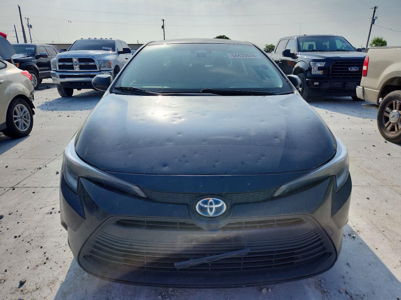 2024 Toyota Corolla Hybrid Le Black vin: JTDBCMFE4R3030480