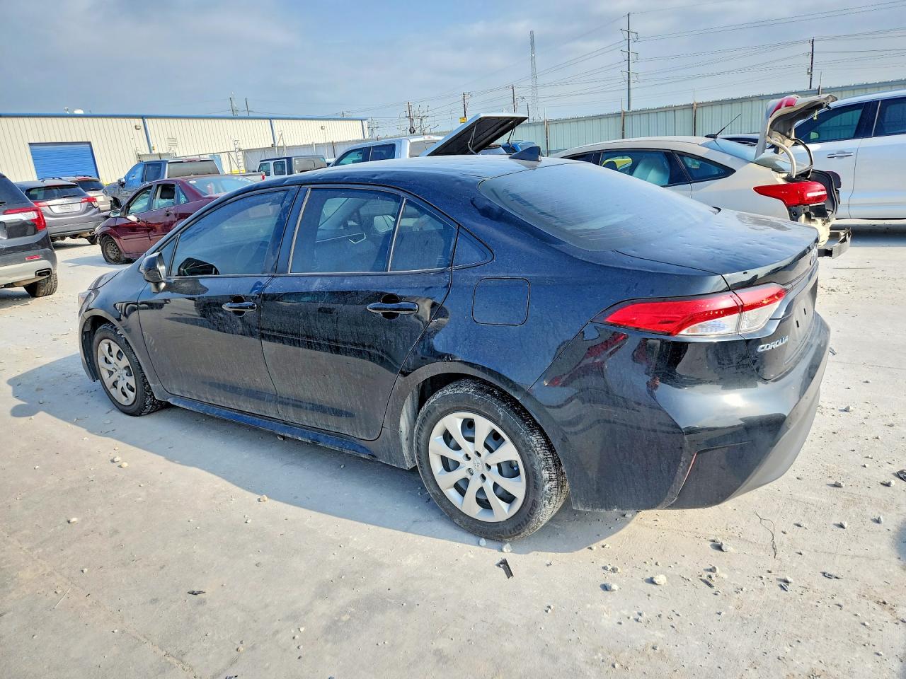 2024 Toyota Corolla Hybrid Le Black vin: JTDBCMFE4R3030480