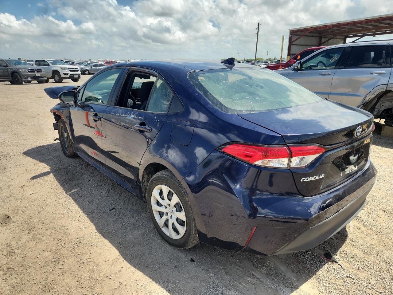 2023 Toyota Corolla Hybrid Le Blue vin: JTDBCMFE7PJ011883 Damage: Left Front Wheel Cover, Broken, Replacement Required