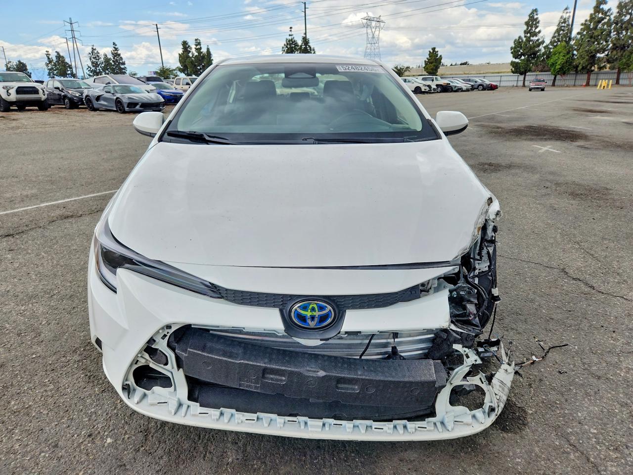 2025 Toyota Corolla Hybrid Le White vin: JTDBCMFEXS3088051