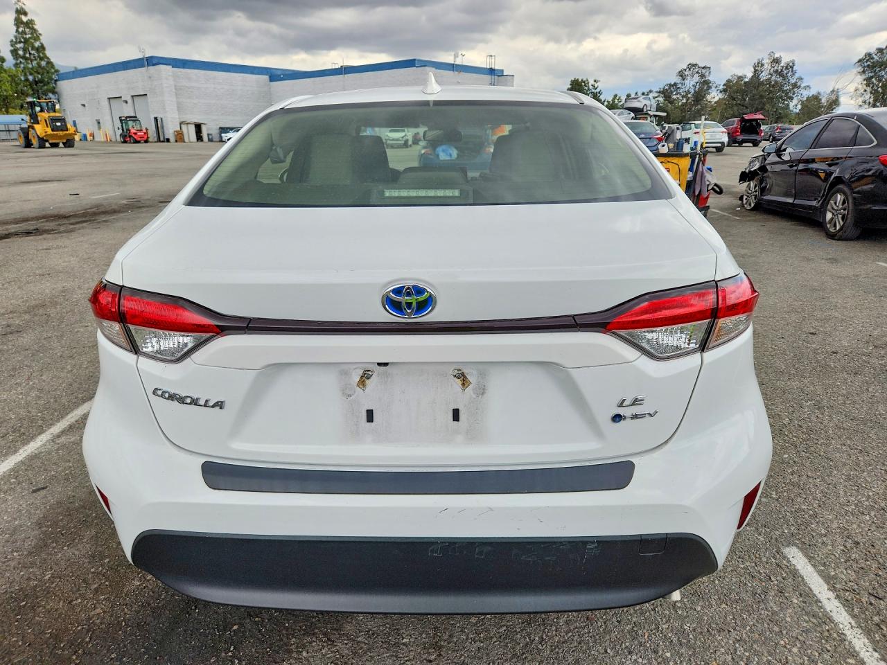 2025 Toyota Corolla Hybrid Le White vin: JTDBCMFEXS3088051