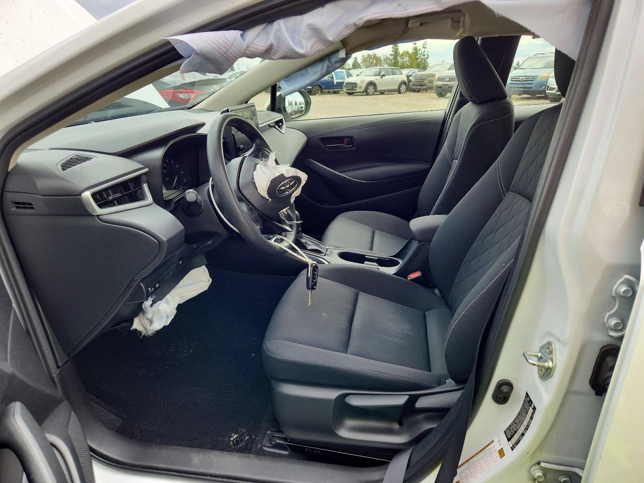 2025 Toyota Corolla Hybrid Le White vin: JTDBCMFEXS3088051