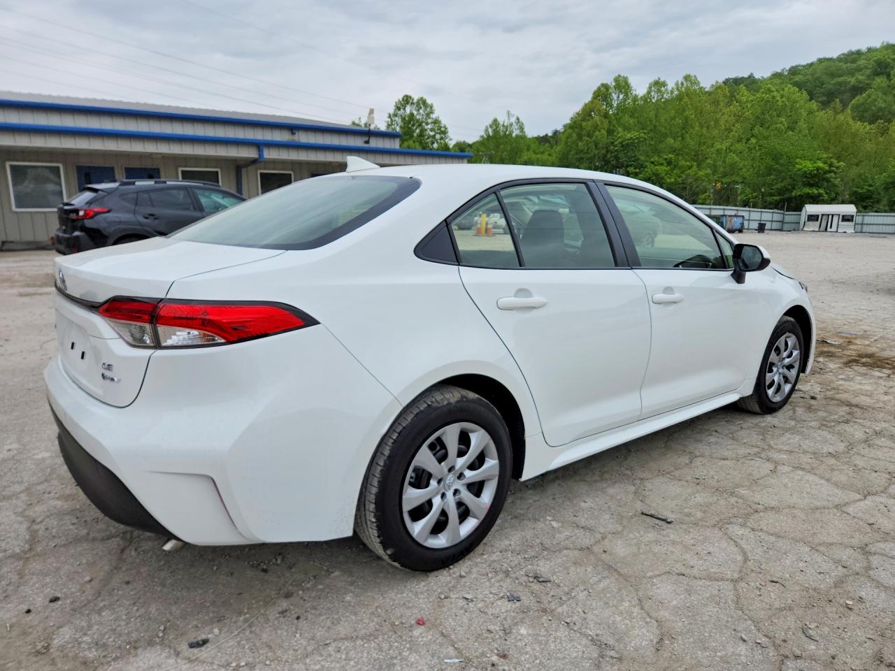 2026 Toyota Corolla Hybrid Le White vin: JTDBCMFEXT3147584