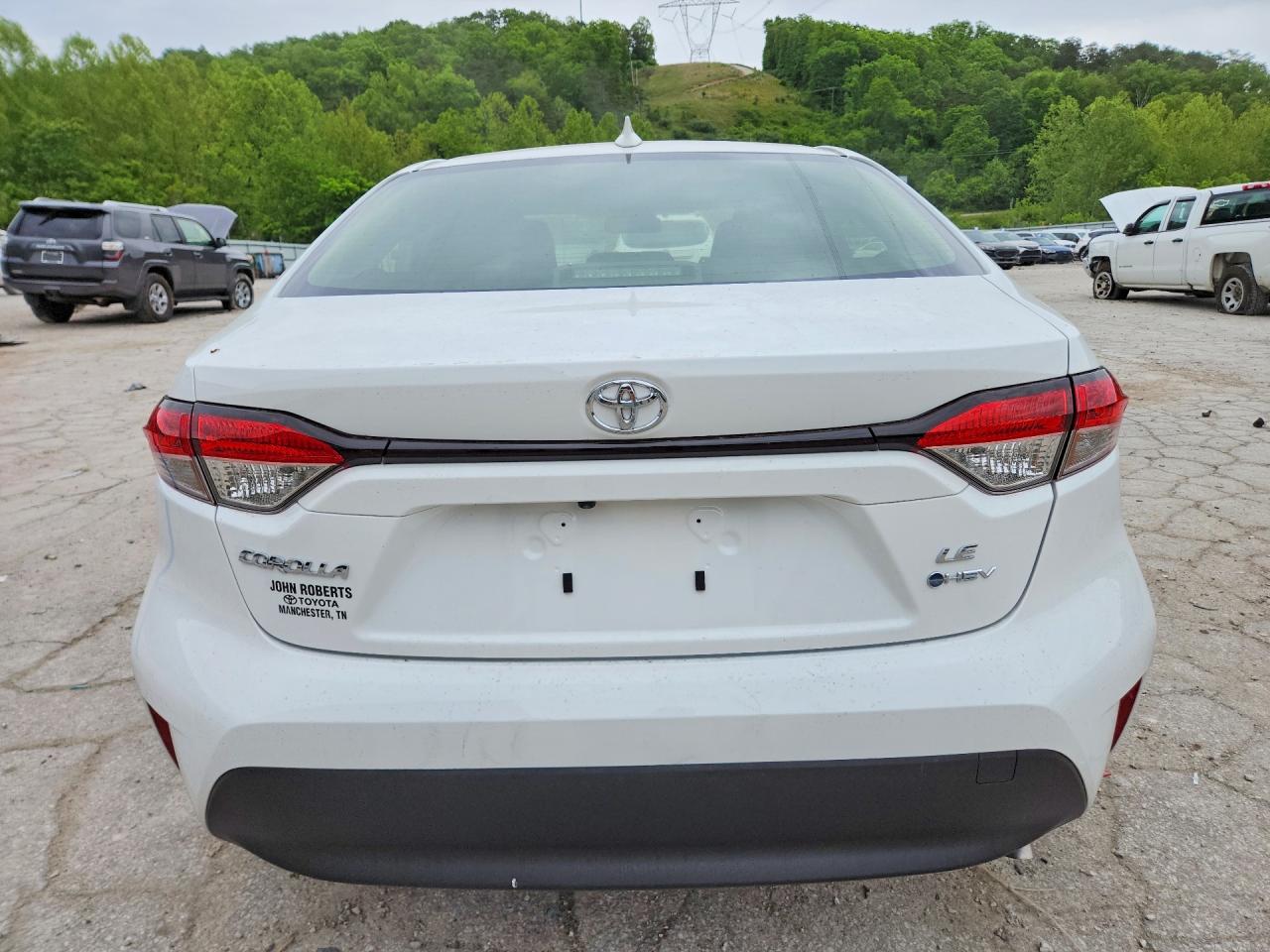 2026 Toyota Corolla Hybrid Le White vin: JTDBCMFEXT3147584