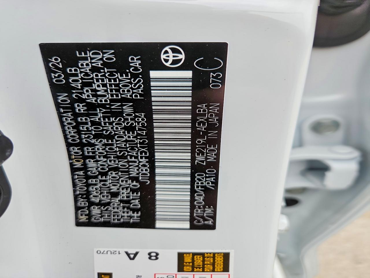 2026 Toyota Corolla Hybrid Le White vin: JTDBCMFEXT3147584