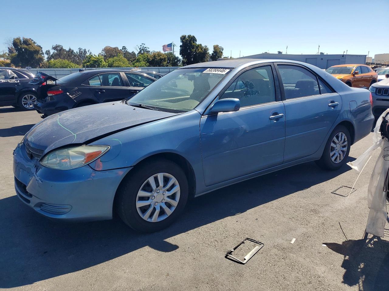 2002 Toyota Camry Le Blue vin: JTDBE32K020121995