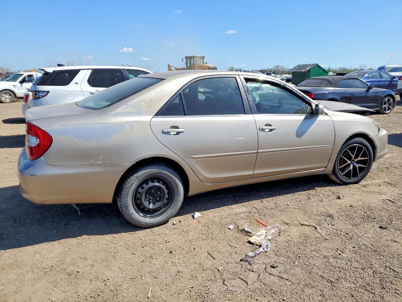 2002 Toyota Camry Le Tan vin: JTDBE32K120052279