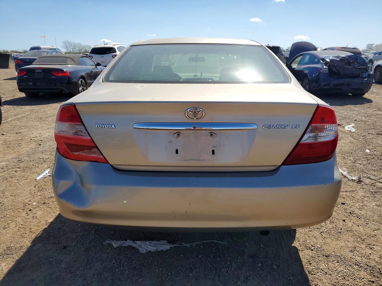 2002 Toyota Camry Le Tan vin: JTDBE32K120052279