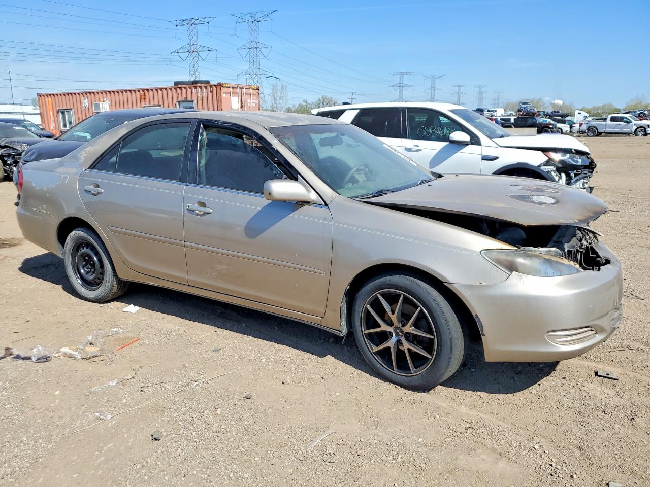 2002 Toyota Camry Le Tan vin: JTDBE32K120052279