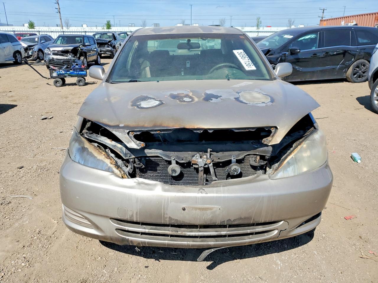 2002 Toyota Camry Le Tan vin: JTDBE32K120052279