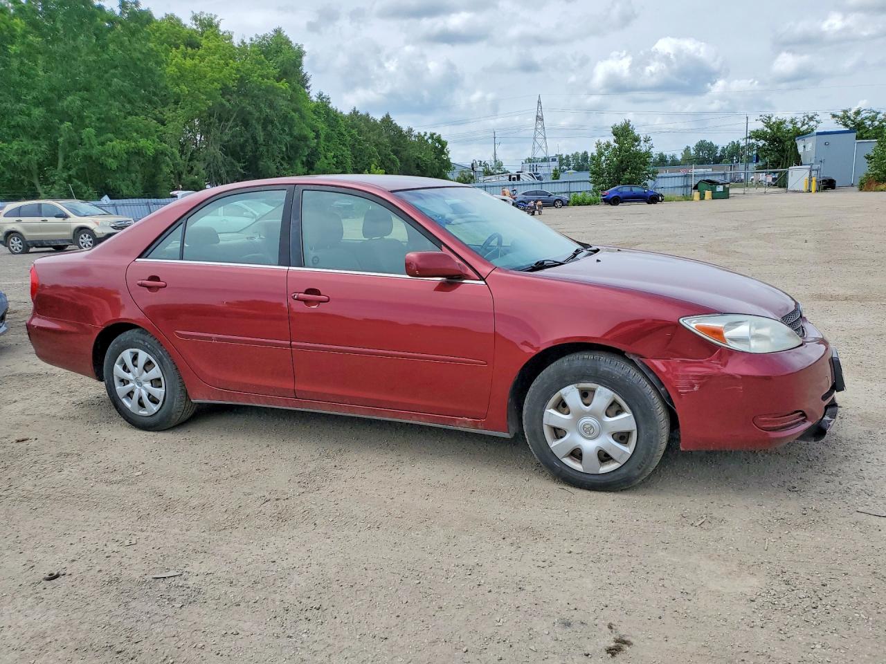2002 Toyota Camry Le Maroon vin: JTDBE32K220073335