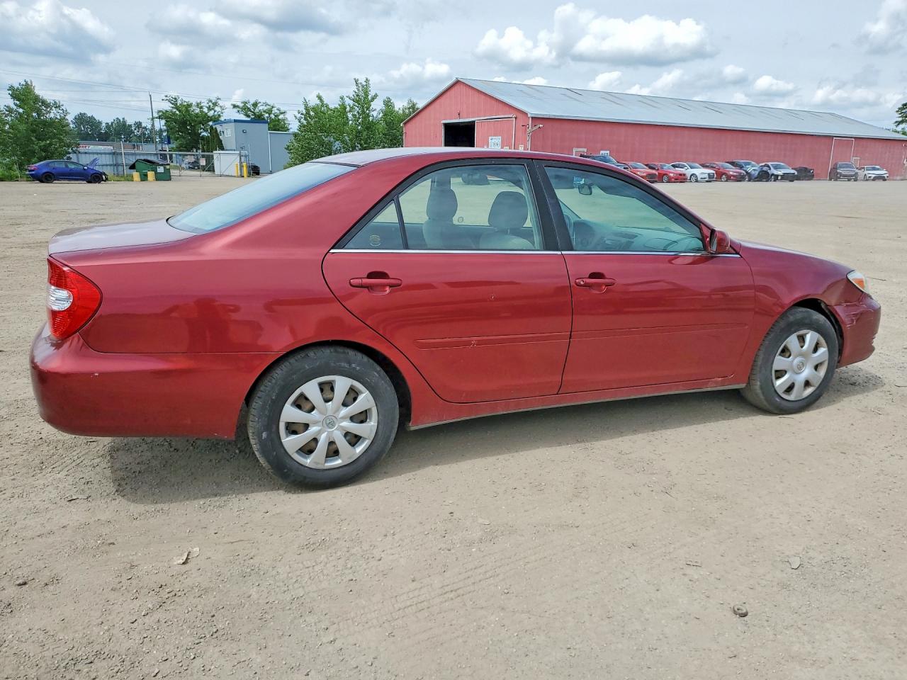 2002 Toyota Camry Le Maroon vin: JTDBE32K220073335