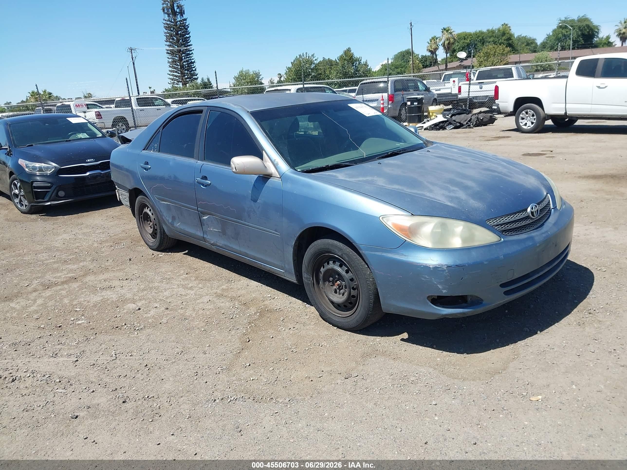 2002 Toyota Camry Le Blue vin: JTDBE32K620029967