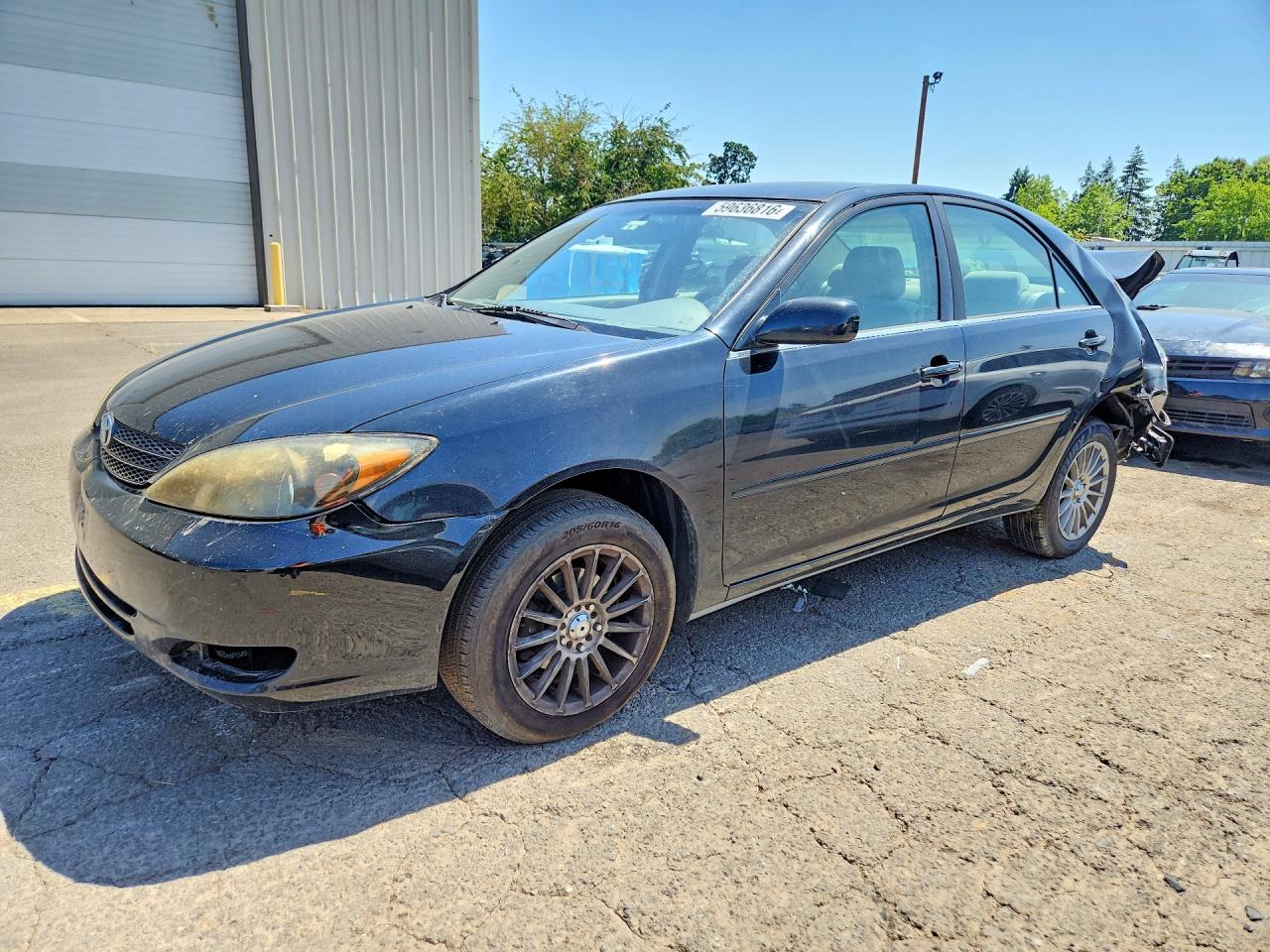 2003 Toyota Camry Le Black vin: JTDBE32K930156584