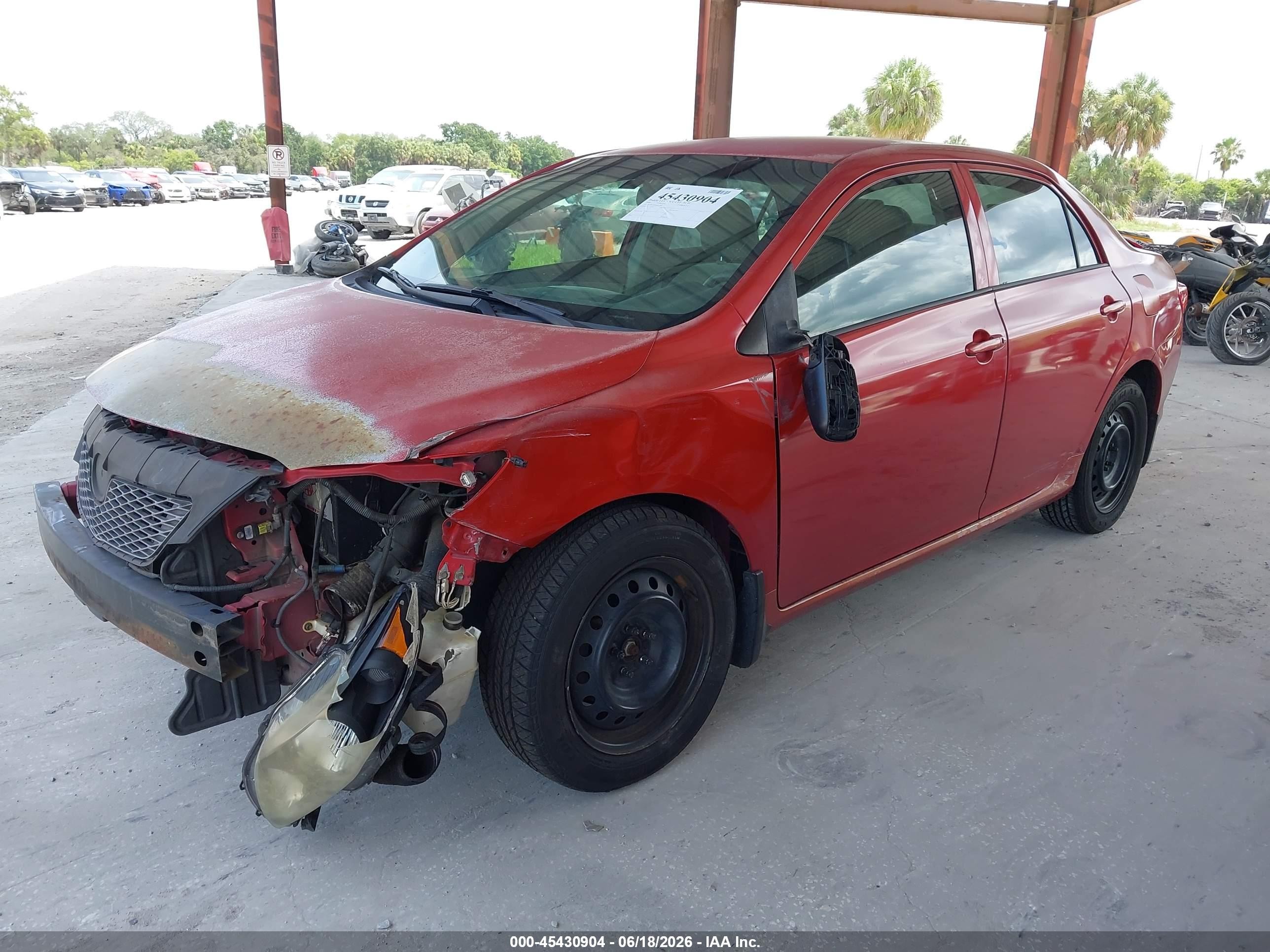 2009 Toyota Corolla Le Red vin: JTDBL40E09J017486