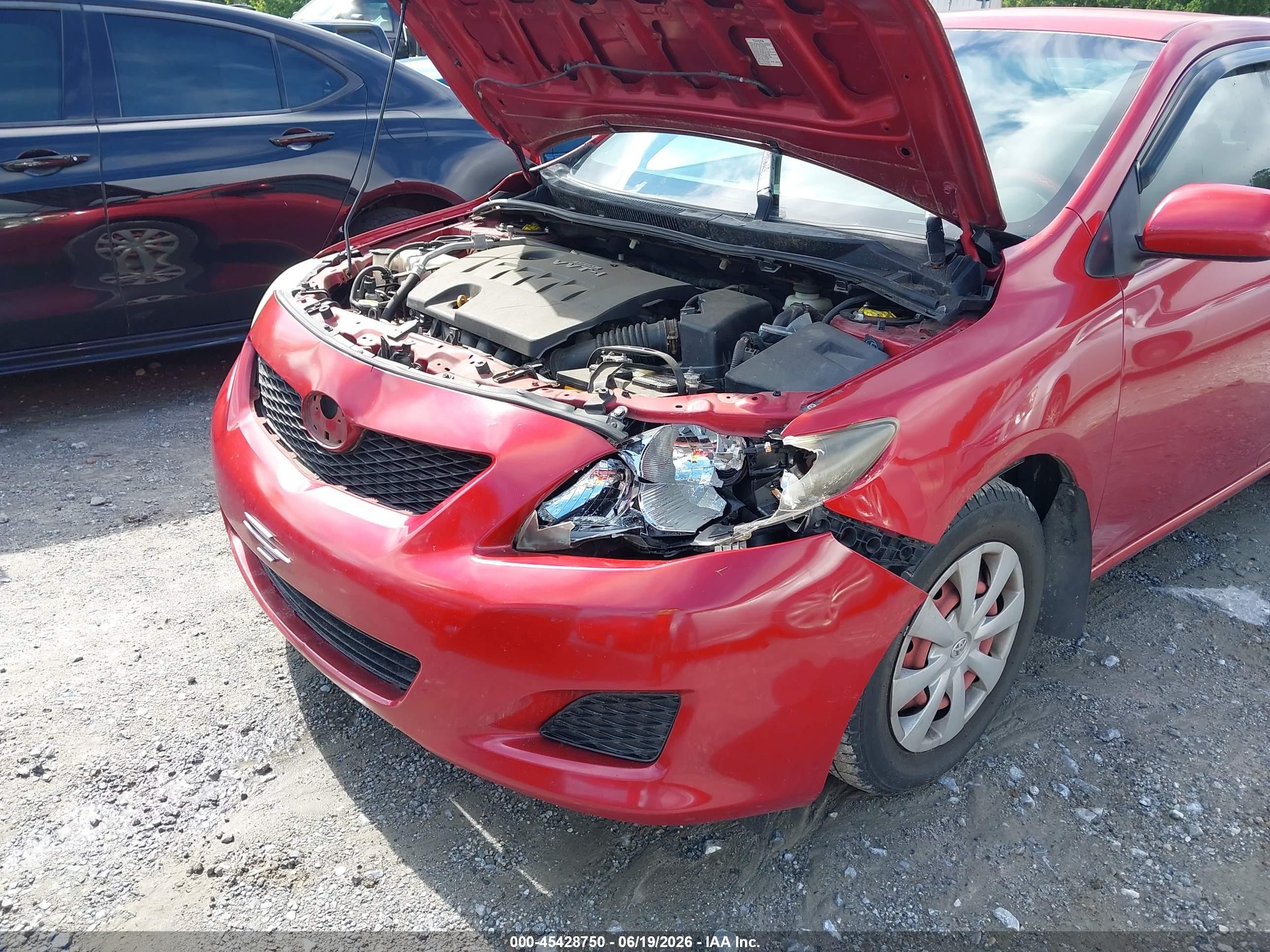 2009 Toyota Corolla Le Red vin: JTDBL40E299060132
