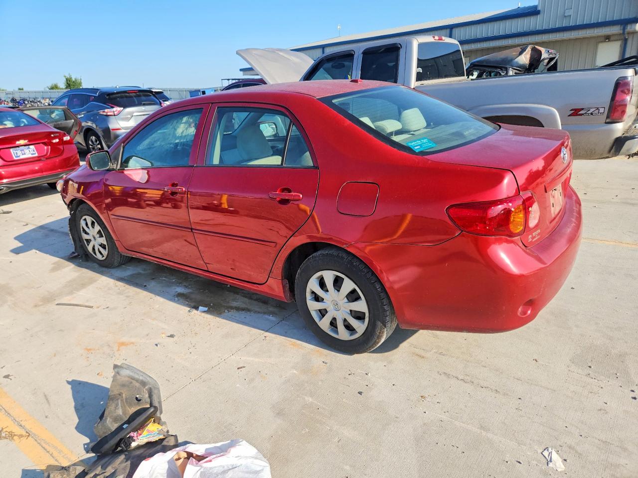 2009 Toyota Corolla Le Red vin: JTDBL40E399079482