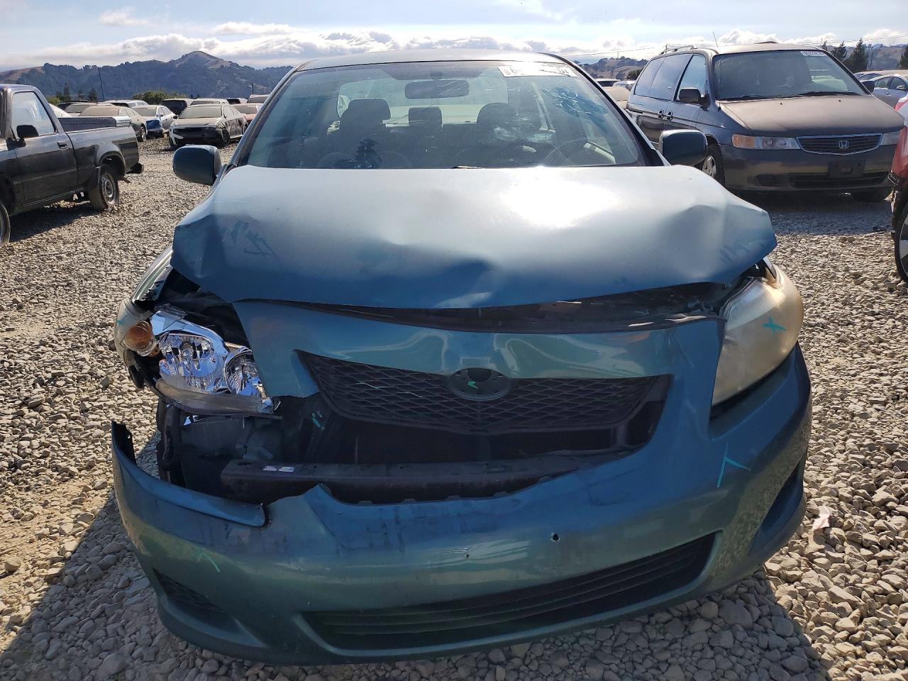 2009 Toyota Corolla Le Teal vin: JTDBL40E799070932