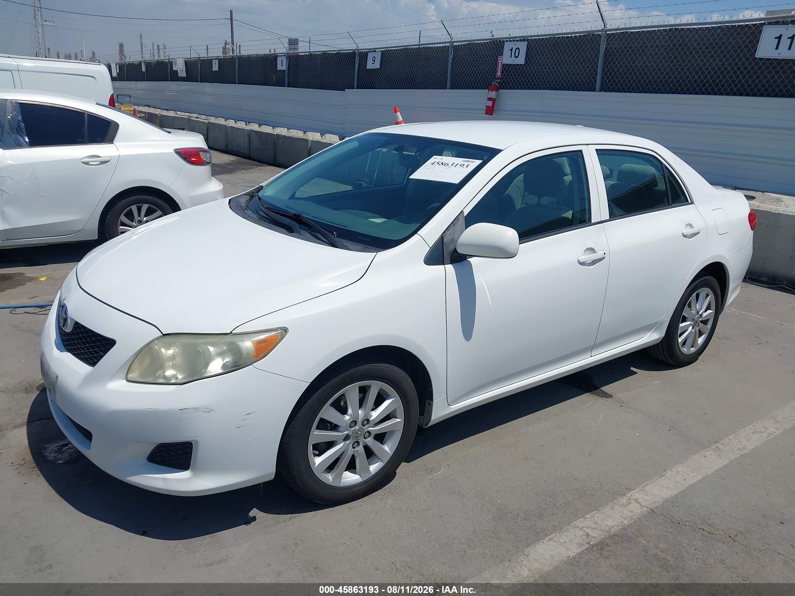 2009 Toyota Corolla Le Белый vin: JTDBL40E799071997
