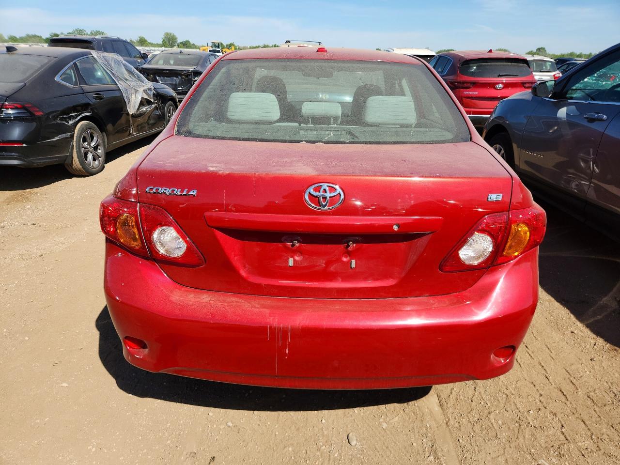 2009 Toyota Corolla Le Red vin: JTDBL40E799075855
