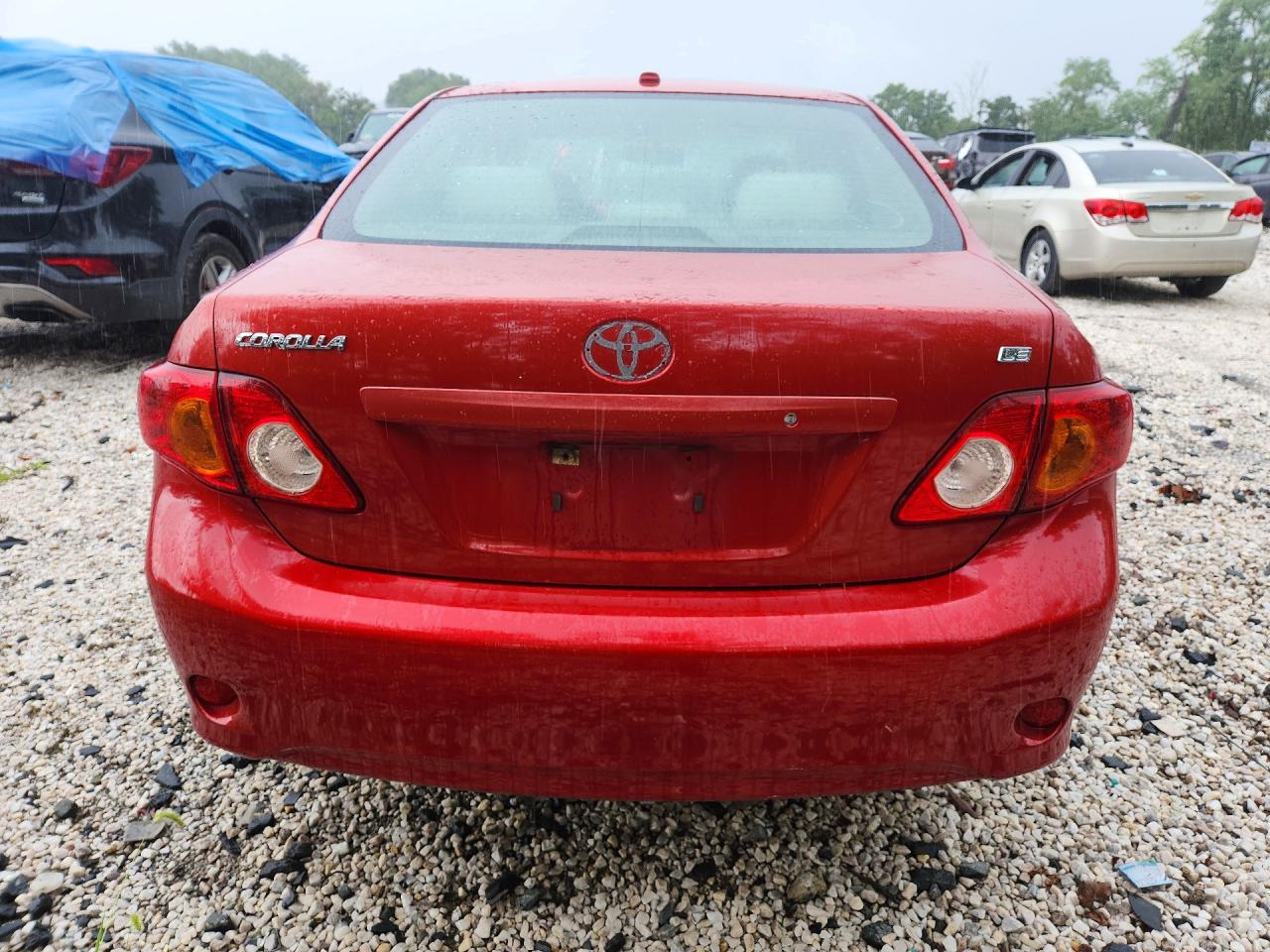 2009 Toyota Corolla Le Red vin: JTDBL40E79J047925