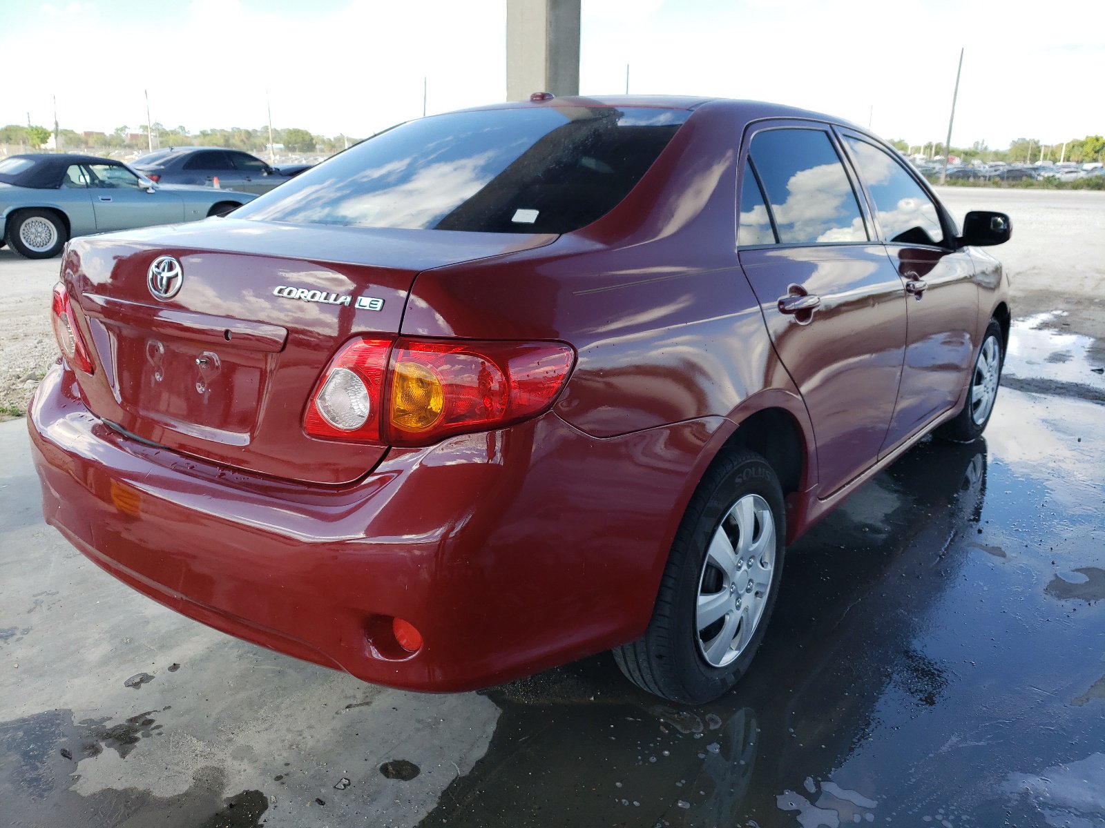 2009 Toyota Corolla Le Burgundy vin: JTDBL40E999027855