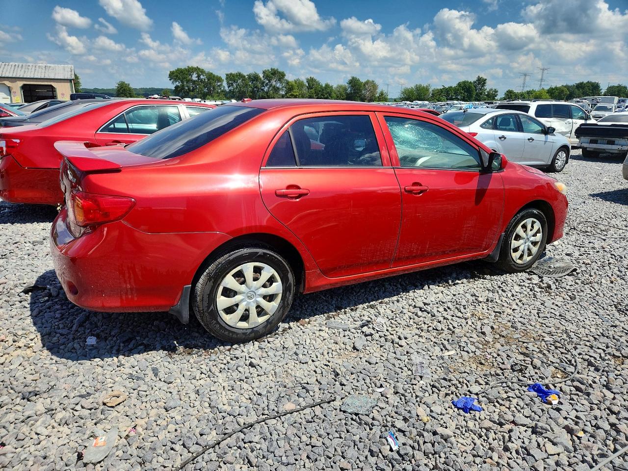 2009 Toyota Corolla Le Red vin: JTDBL40EX99093878
