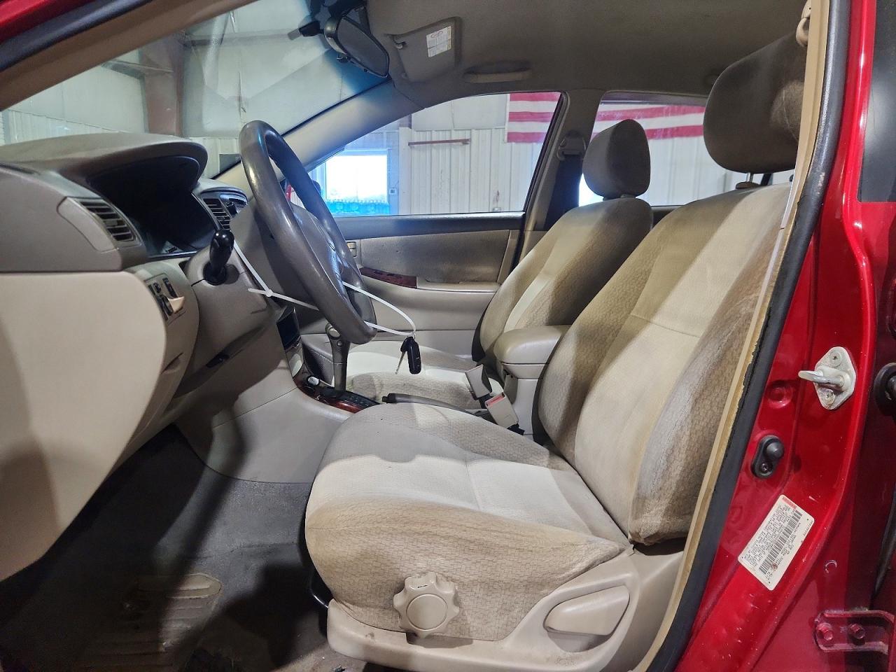 2003 Toyota Corolla Le Красный vin: JTDBR32E830034670