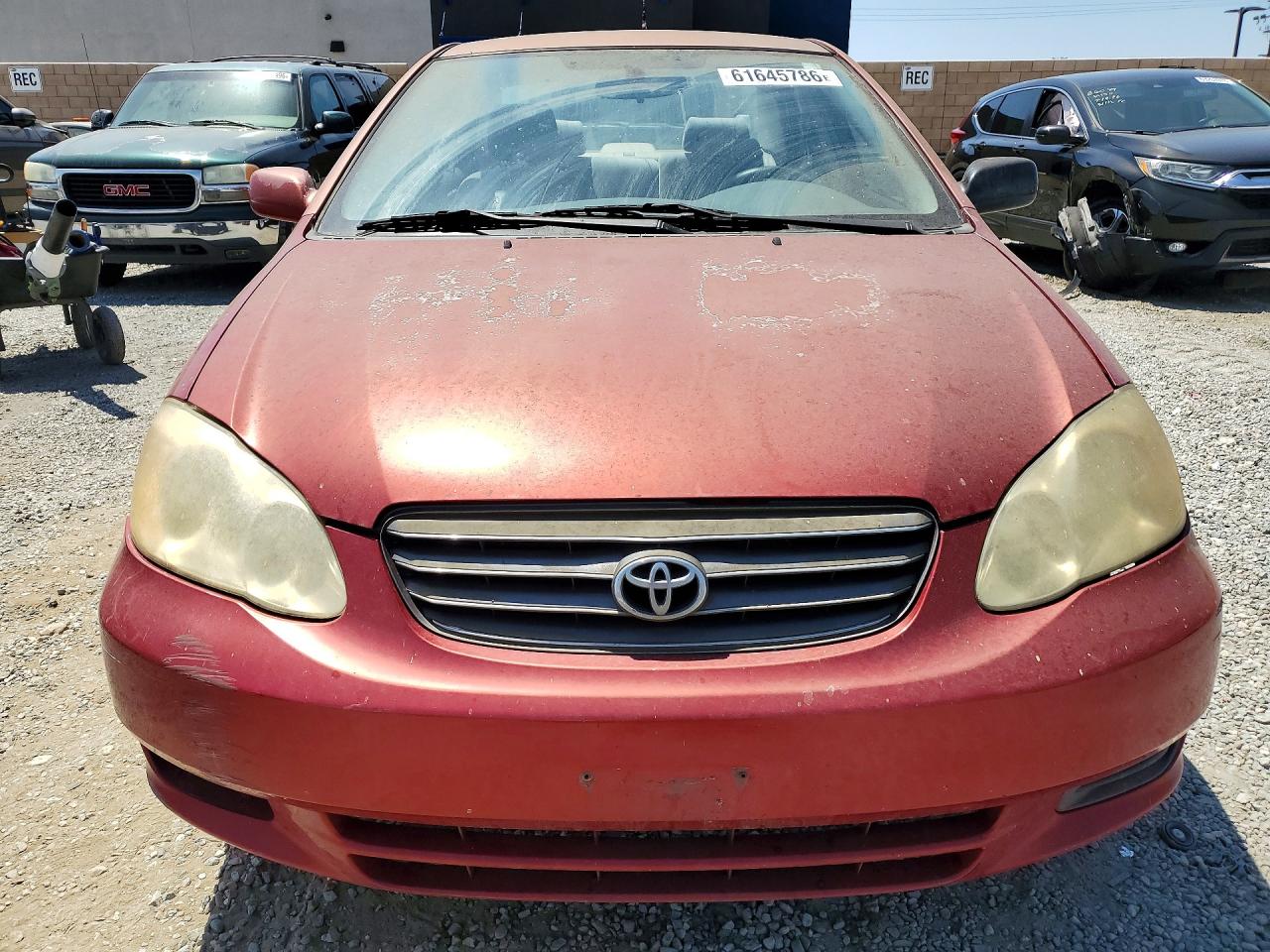 2003 Toyota Corolla Le Красный vin: JTDBR32E930046813