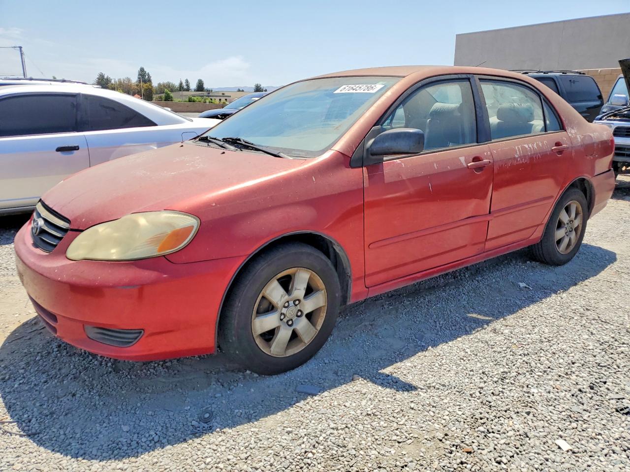 2003 Toyota Corolla Le Красный vin: JTDBR32E930046813
