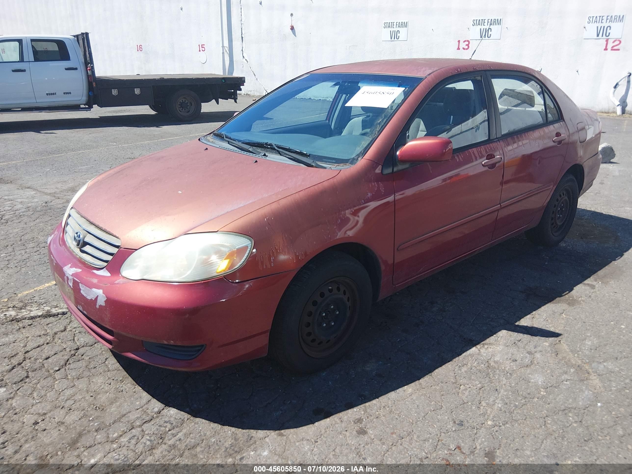 2003 Toyota Corolla Le Red vin: JTDBR38E732009870