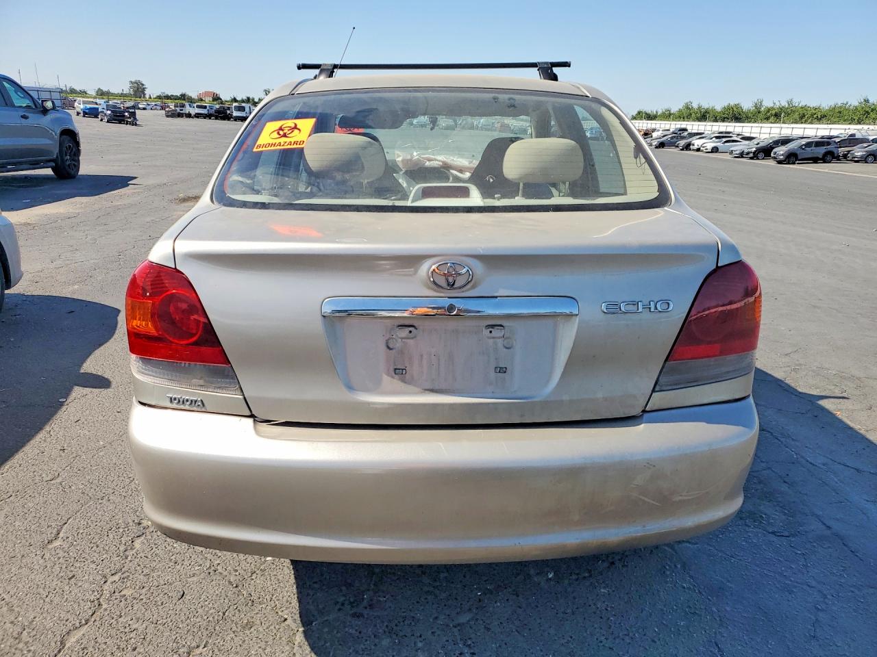 2003 Toyota Echo Base Tan vin: JTDBT123630259965